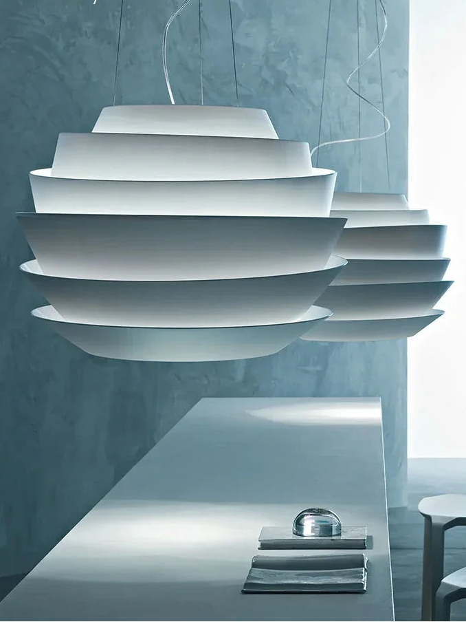 Modern pendant light with 'Carl' branding against a neutral background