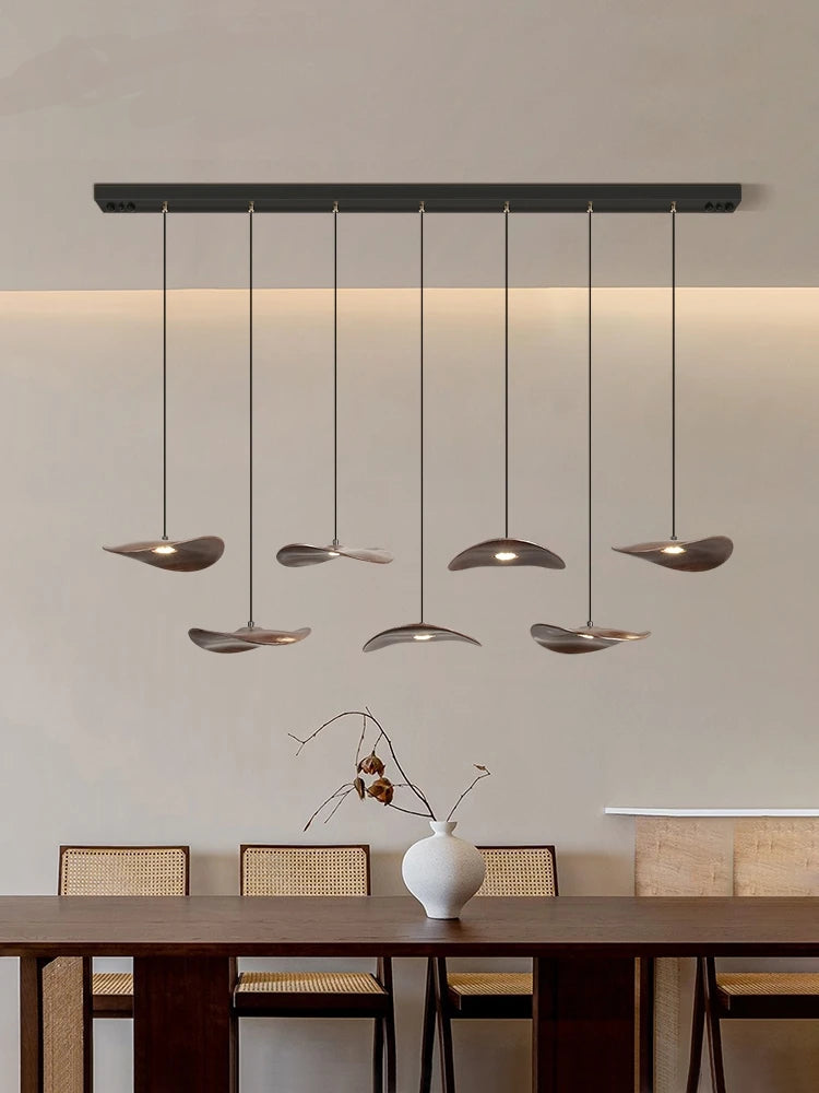 Modern pendant light fixture in a dining room setting.